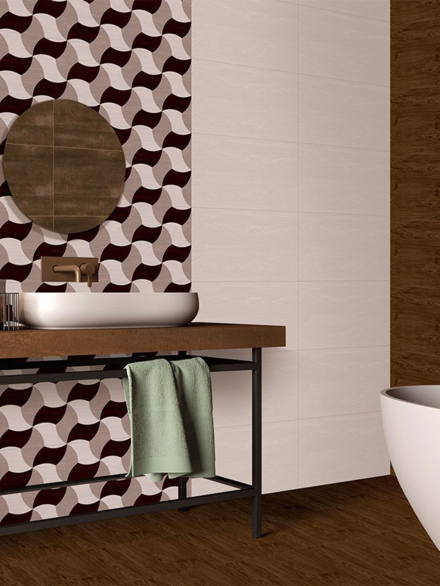 Bathroom interior with a wooden vanity, sink, and towel, featuring a geometric patterned wall.