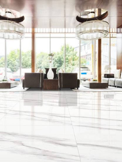 Modern interior design of a lobby with large windows, chairs, and decorative elements.