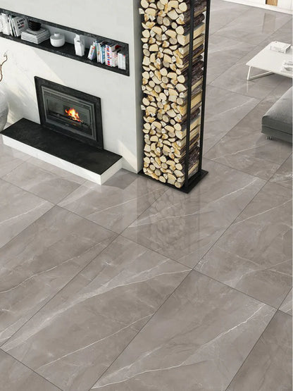 Gray tiled floor with a fireplace and wooden logs in a living room setting.